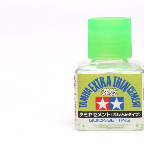 Tamiya's excellent Extra Thin Liquid cement for plastic models